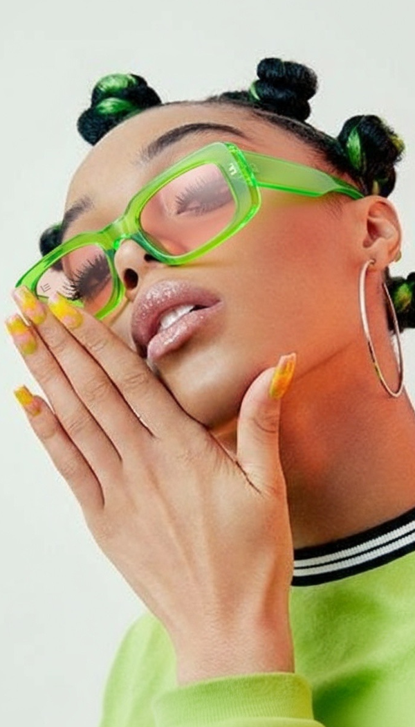 Person wearing green sunglasses and a green outfit with a white background