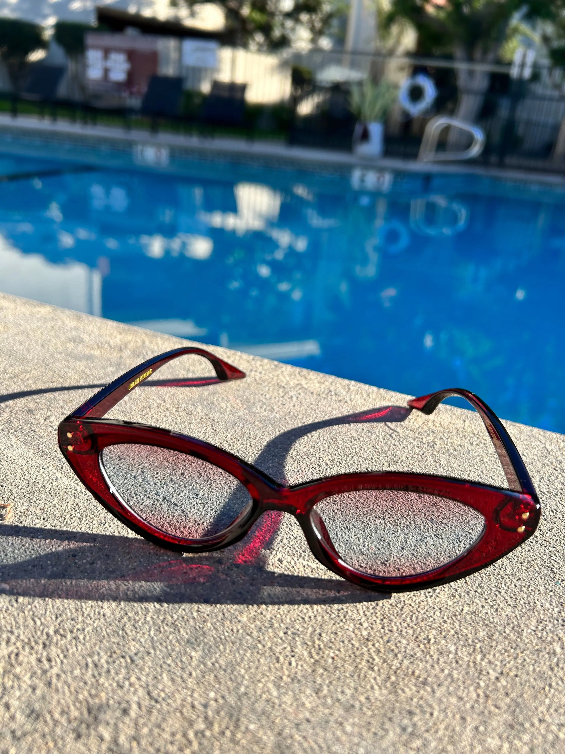 Wear Me - Liberated Eyewear, Inc. designer polycarbonate polarized red cat eye sunglasses