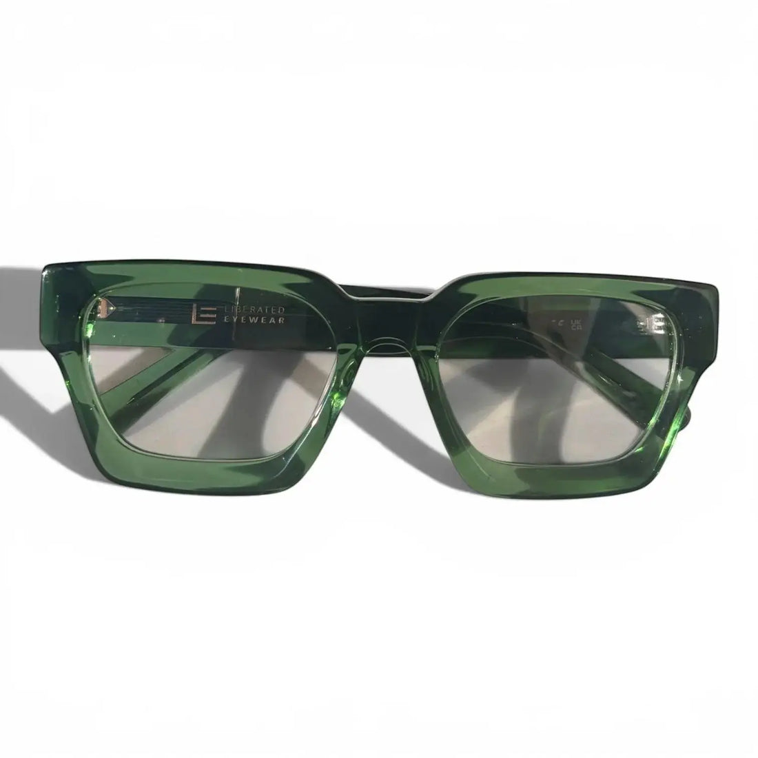 Liberated Eyewear, Inc. Jade rectangular glasses in translucent green handcrafted acetate with sharp modern lines.