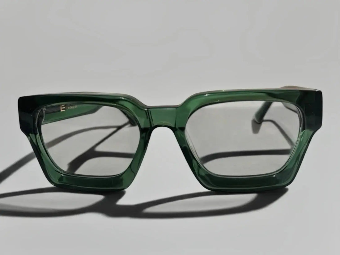 Liberated Eyewear, Inc. Jade rectangular glasses with a translucent green handcrafted acetate frame.