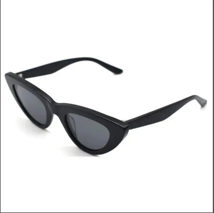 A pair of black  Italian acetate eco friendly cat eye sunglasses with a glossy finish.
