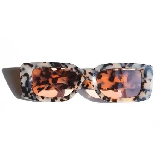 A pair of square retro sunglasses with a multicolored frame and polarized lenses.
